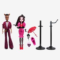 two dolls are standing next to each other and one is holding an umbrella, the other has a cat
