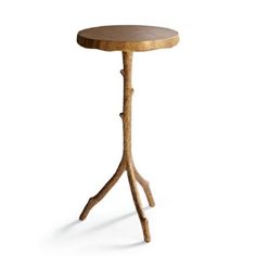 a wooden table with two legs and a small round top on the bottom is made from wood