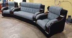 three blue and black couches sitting next to each other