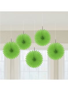 green paper fan decorations hanging from the ceiling