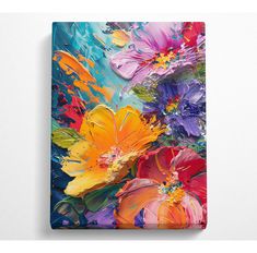 an abstract painting of colorful flowers on a white wall