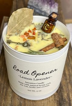 a white bucket filled with food on top of a wooden table