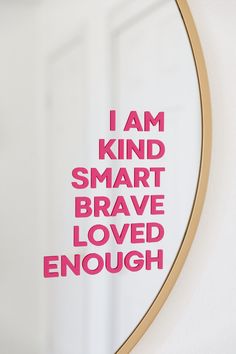 a mirror with the words i am kind of smart brave loved enough on it