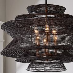 a black chandelier hanging from the ceiling