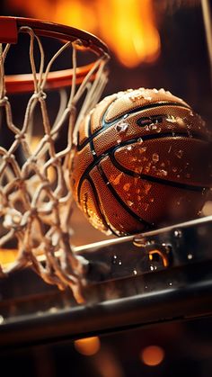 a close up of a basketball going through the net