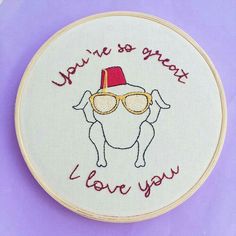 a embroidery pattern with a dog wearing sunglasses and a hat