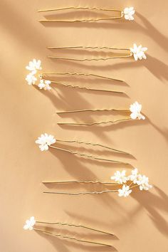 Enhance your hairstyle with the subtle sophistication of the Natural Pearl Hair Pins, each one a delicate adornment crafted to add a touch of timeless grace to your look. | Natural Pearl Hair Pins, Set of 7 by Anthropologie in White, Women's, Gold/Plated Brass Hawaiian Hairstyles, Hair Accessories Pins, Lace Burgundy Dress, Hair Accessories Pearl, Pearl Hair Pins, Pearl Hair Clip, Bride Hair Accessories, Fancy Hairstyles, Your Hairstyle