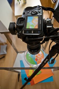 a camera sitting on top of a glass table