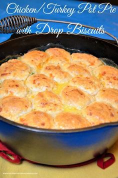 chicken and turkey pot pie with drop biscuits in a cast iron skillet