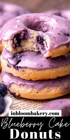 blueberry cake donuts are stacked on top of each other