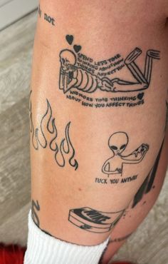 a person with tattoos on their legs and leggings that have different things in them