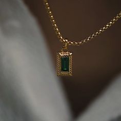 Featuring our signature emerald gemstones and textured border, the 'Emerson' necklace effortlessly combines timeless elegance with a modern edge, making it the perfect accessory to elevate any ensemble. Whether worn for a special occasion or as a statement piece for everyday wear. All of our 18k gold or silver plated jewellery should be stored in a cool, dry place and cleaned carefully with a soft non-abrasive cloth to maintain shine.  Our pieces also contain real glass stones, cubic zirconia or Draco Malfoy Jewelry, Gold And Emerald Necklace, Emerald Gold Necklace, Elegant Watches Women, Gold Jewelry Prom, Emerald Green Necklace, Gold Pendants, Indian Jewellery Design Earrings, Emerald Pendant