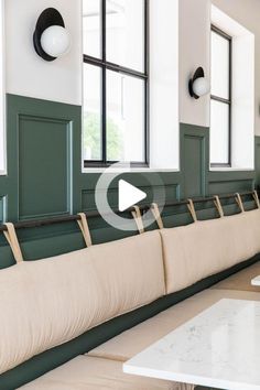 the benches are lined up against the wall in the room with no one on them