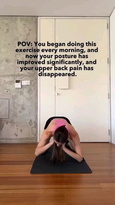 a woman is doing yoga on a mat in front of a wall with an inspirational quote