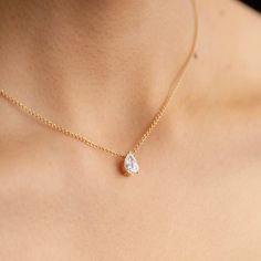 The ultimate timeless piece. A solitaire pear is centered between the collarbone on an 18k gold chain. The length of this necklace is 16" (40cm). Please get in touch if you would like a different chain length. Shape, color, and size of this pear diamond necklace are fully customizable as well. Pear Shape Diamond Necklace, Pear Diamond Pendant, Pear Diamond Necklace, Unique Diamond Pendant, Pear Shaped Diamond Necklace, Minimal Pendant, Minimalistic Jewelry, Solitaire Diamond Pendant, Pretty Jewelry Necklaces