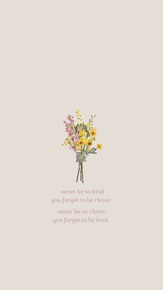 a bouquet of flowers sitting on top of a white wall next to a quote that reads,