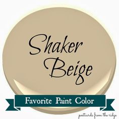 the words shaker beige are painted on a white button