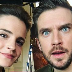 a man and woman with blue eyes posing for a photo in front of a camera