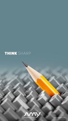 an orange pencil sitting on top of a computer keyboard with the words think sharp above it