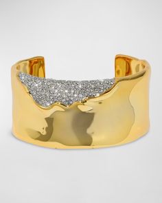 a gold cuff with diamonds on it