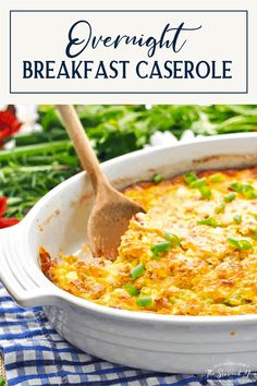 a casserole dish with cheese and green onions in it on a checkered table cloth