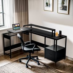 a black desk with a laptop on it in front of a window and a rug