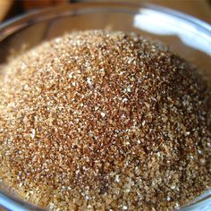 a glass bowl filled with brown and white grains