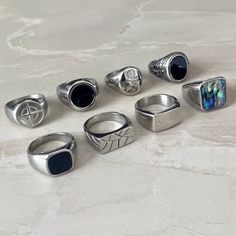 Choose from 8 of our favourite signet rings. ➤Weighty and Durable Stainless Steel ➤The perfect, low key ring for daily wear ➤Multiple Sizes available ➤Made with High Quality 316L Stainless Steel for a premium finish Please Note: This includes 1 ring not a full set of 8. Please pick the style that you would like from the photos. Please check our size chart in the last image before ordering. Shipping: We aim to ship your order out as soon as possible and offer Free First Class Delivery to the UK. Cool Accessories For Men, Mens Ring Designs Silver, Rings For Men Aesthetic, Men’s Jewellery, Streetwear Rings, Cool Mens Rings, Rings For Boys, Masculine Rings, Mens Signet Rings