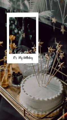 a white cake sitting on top of a wooden table