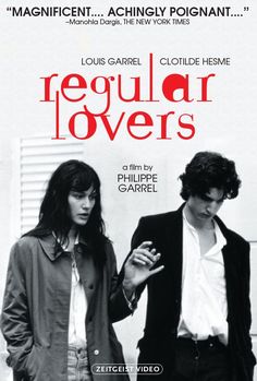 a movie poster for regular lovers with two people standing next to each other and looking at their cell phones