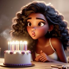 a woman blowing out candles on a cake