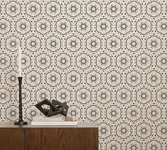 a black and white wallpaper with an intricate design on it's sideboard