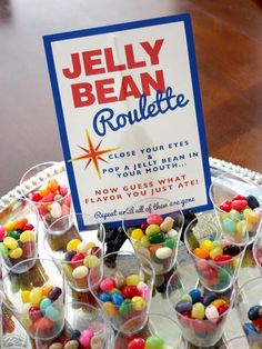 jelly bean roulette cups on a tray with a sign