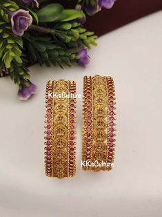 Gold Plated Laxmi Coin Bangles studded with faux ruby stones in gold finish.  Non Openable. Brass is  used as base metal. A perfect piece of art always a keeper in your jewelry trinket that goes with Ethnic Attire /  Indian outfits.  👉🏻Size Available: suitable for bangle size 2.4 & 2.6  👉🏻Premium Quality CZ & semi precious stones that's all it goes in here.  ✅Check other styles available in our store https://www.etsy.com/shop/KKsCulture Send us an email if you need help!  SHIPPING & TURNAROUND  👉🏻Please check listings for shipping and turnaround times.  👉🏻We follow item dispatch in 1-2 business days for most of our shipments.  👉🏻All pre orders will take approximately 3 weeks. 👉🏻Free domestic delivery across US on orders over $35.  For any other query or assistance with shipping Gold Coin Bangles, Ruby Bangles Gold, Bridal Gold Bangles, Bangles Jewelry Designs Gold, Gold Bracelet Indian, Indian Jewelry Gold, Indian Gold Necklace Designs, Jewelry Indian Wedding, Ruby Bangles