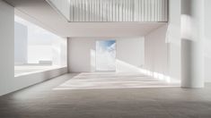 an empty room with white walls and columns