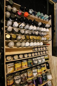 the shelves are filled with spices and jars