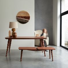 a wooden table sitting next to a white couch