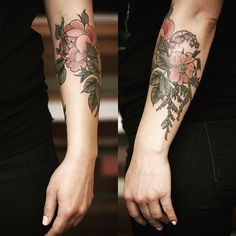 two women holding hands with tattoos on them