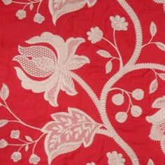 a red and white fabric with flowers on it