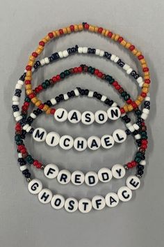 three bracelets with words that spell out the names of two different people, one for each