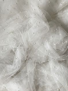 white tulle with pearls on it