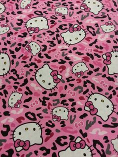 pink and black hello kitty print fabric