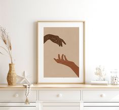 two hands reaching for each other above a dresser