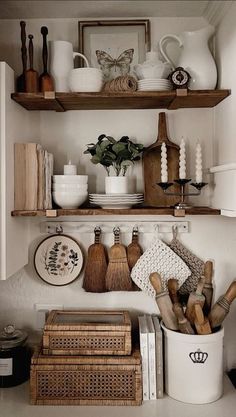 the shelves are filled with dishes and cooking utensils