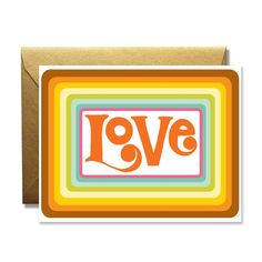 a greeting card with the word love in orange, yellow and blue on it's front