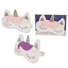 two white and pink unicorn masks with gold glitter horns on them, one is laying down