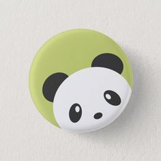 a button with a panda bear face on it