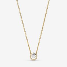 a gold necklace with a single diamond on the front, and a chain that is attached to it