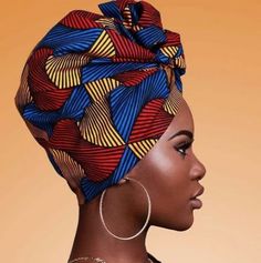 an african woman wearing a colorful head wrap