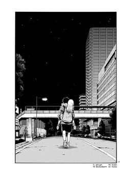 a black and white image of a person walking down the street in front of tall buildings